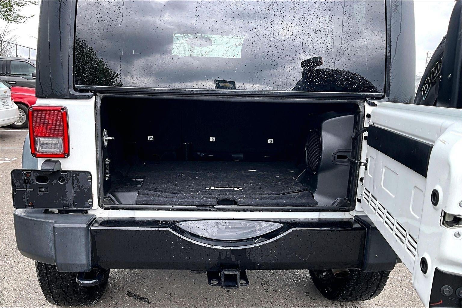 Used 2014 Jeep Wrangler Unlimited Willys Wheeler with VIN 1C4BJWDG9EL255879 for sale in Kansas City